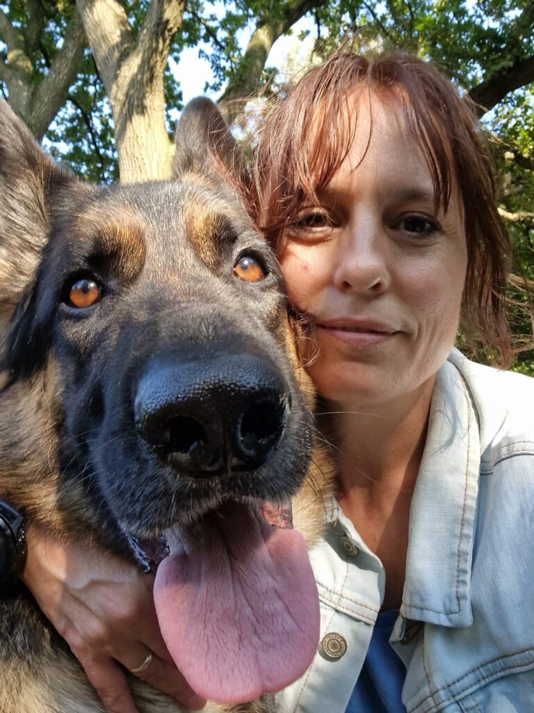 Maria, watercolour artist behind Mariflo Designs, with her German Shepherd Sylas